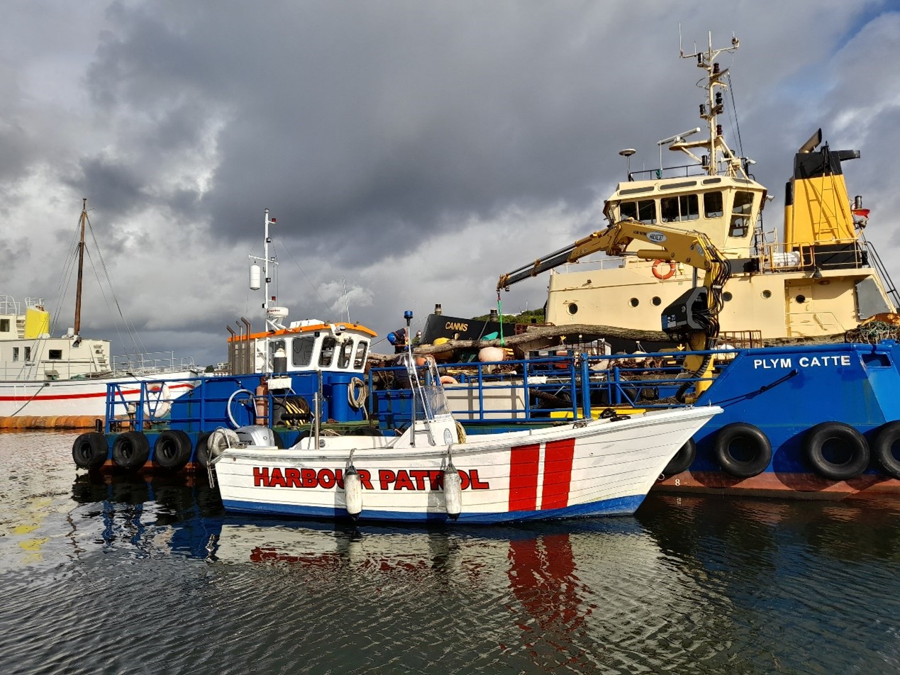 The Cattewater Harbour Commissioners Harbour Patrol vessel alongside the work boat Plym Catte and tug Cannis