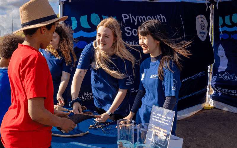 Our Meet the Marine Park team talking to two boys - Mount Batten Beach, Plymouth