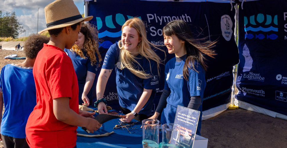 Our Meet the Marine Park team talking to two boys - Mount Batten Beach, Plymouth