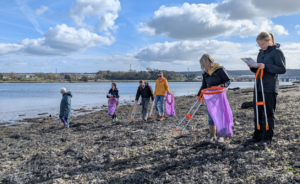 Plymouth Sound National Marine Park Coastal Rangers and volunteers litterpicking during a Coastal Clean Up event at Blagdons Meadow.