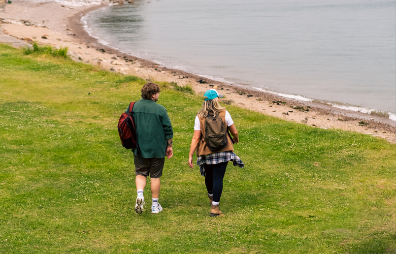 Man and woman walking around Mount Edgcumbe Country Park, Plymouth Sound National Marine Park
