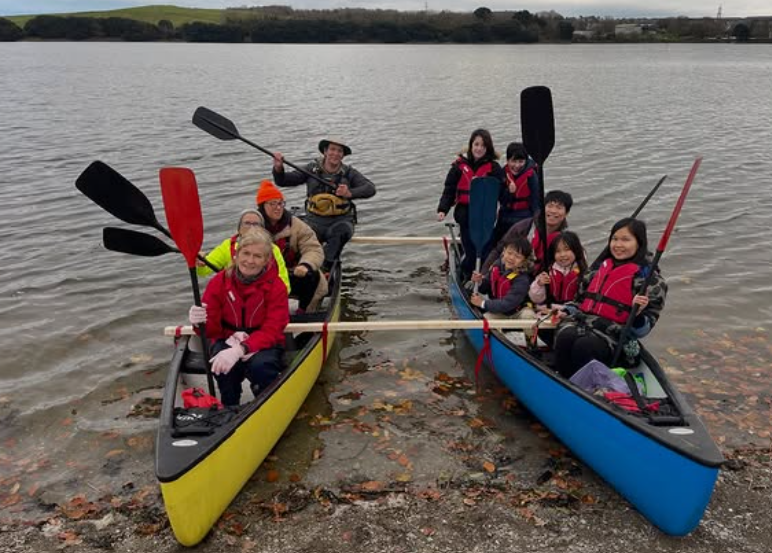 Blue Sparks - Ethical Activities - A group of people on two canoes ready to explore a local creek